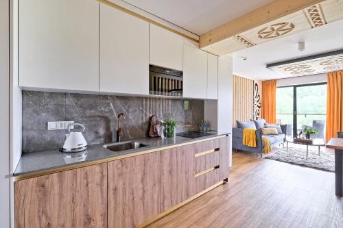 a kitchen with a sink and a counter top at Aparthotel Góralski Spa 2 in Białka Tatrzanska