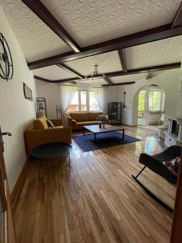 a living room with a couch and a table at Zarzecze 27A in Augustów