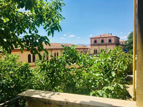 a view of a building from a tree at Affittacamere Ferranti tra Caserma e stazione in Foligno