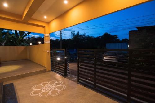 a view from the balcony of a house at night at Saffron Vilva in Puducherry