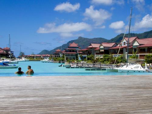 two people in the water in a marina at Eden Island Luxury Accommodation in Eden Island