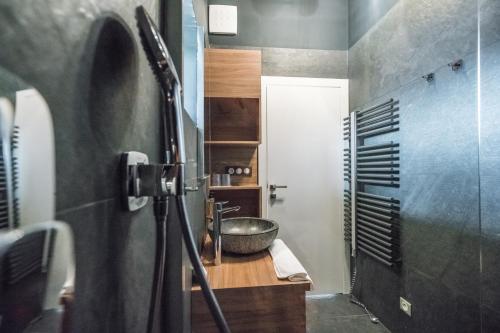 a bathroom with a sink and a bowl at ChaletSKI Jasná, SKI-IN & SKI-OUT in Demanovska Dolina