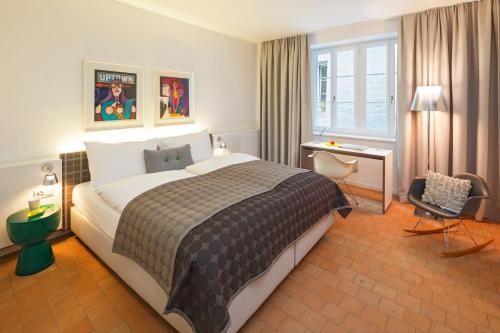 Postel nebo postele na pokoji v ubytování Hotel Rössli