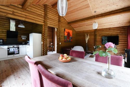 a kitchen and dining room with a table and chairs at Bij de Appelhof in Valkenswaard