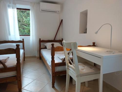 Postel nebo postele na pokoji v ubytování Beachfront House Jovan