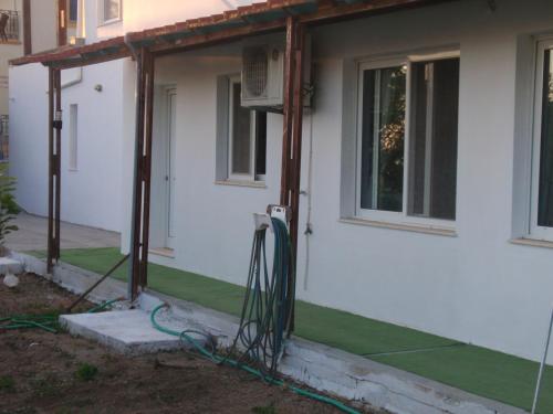 a house being constructed with a green lawn at Traditional House in Myrties