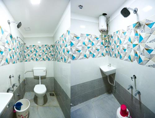 a bathroom with a toilet and a sink at HOTEL GOLDEN CITY in Surat