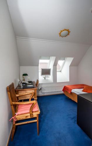 a bedroom with a desk and a bed and a deskictericter at Best Western Hotel Apollo in Oulu