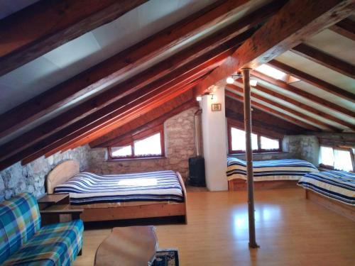 a room with two bunk beds in a attic at Maso Mandrea in Arco