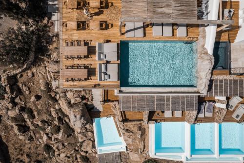 an overhead view of a swimming pool at a resort at Alissachni Mykonos in Psarou