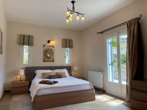 A bed or beds in a room at SUNSENSES Villa