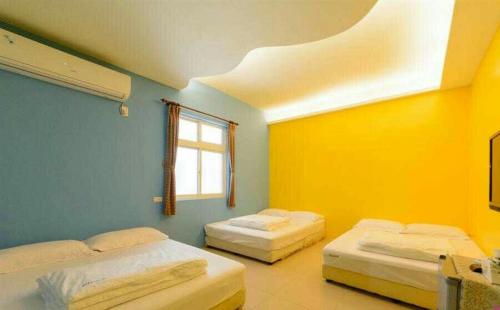 Llit o llits en una habitació de Blue% Hotel