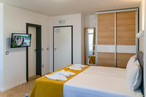 Family Hotel LAXOにあるベッド