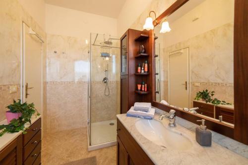 a bathroom with a sink and a shower at Anice, app. Lido di Camaiore private parking in Camaiore
