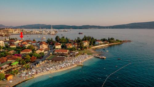 an aerial view of a resort on the water at Rosic Apartments Tivat in Tivat