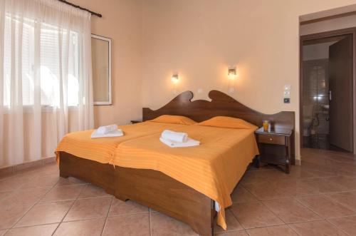 Ένα ή περισσότερα κρεβάτια σε δωμάτιο στο Fouxia Apartments and Studios 