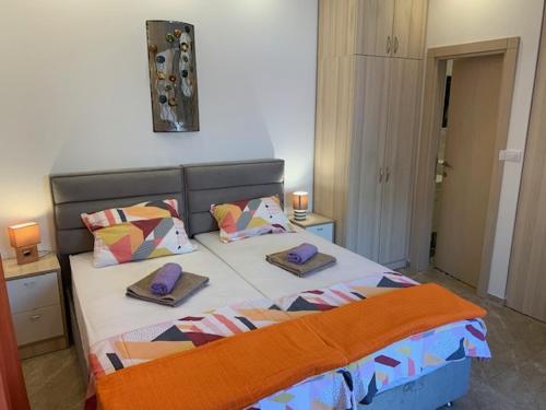 a bedroom with a bed with two pillows on it at Villa Lili in Kotor