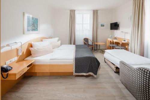 Rúm í herbergi á Hotel Künstlerhaus