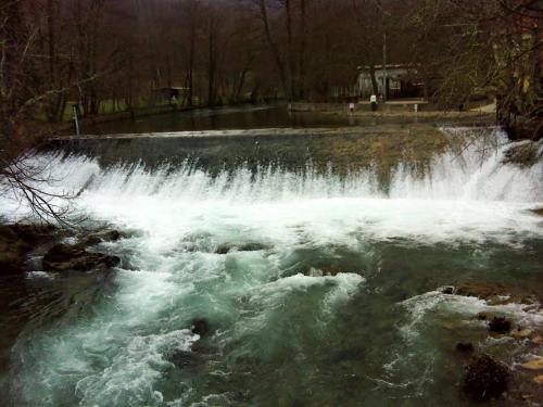 a waterfall with white water in a river at Green House in Rijeka