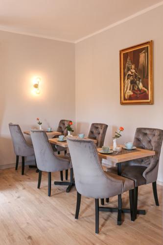 a dining room with wooden tables and chairs at Hotel Waldeslust in Kurort Altenberg