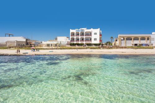 a view of a beach with buildings and the water at Residence Bellavista in Torre Lapillo
