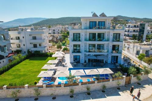 an aerial view of a large white building with a yard at Hotel Alexander in Ksamil