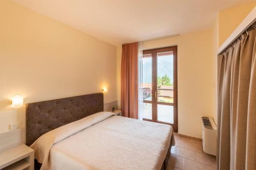 Katil atau katil-katil dalam bilik di Hotel Pineta Campi