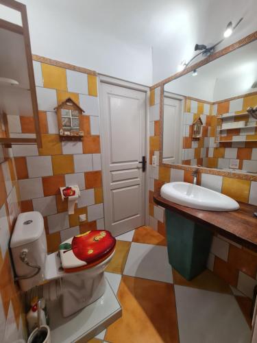 a bathroom with a toilet and a sink at Casa Mathilde in Lecci