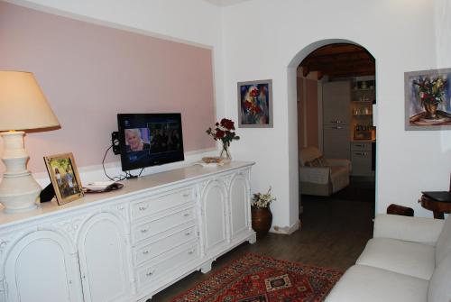 TV a/nebo společenská místnost v ubytování Leodi