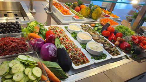a buffet filled with lots of different types of vegetables at Route Active Hotel in Los Realejos