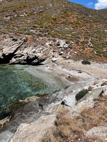 a mountain with a stream of water and rocks at Casa Bianca of Kea in Melissaki
