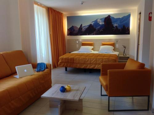 Ein Bett oder Betten in einem Zimmer der Unterkunft Hotel Tamaro