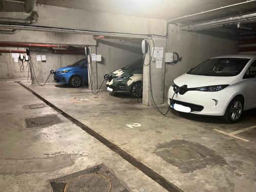 two cars are parked in a parking garage at Hôtel Saphir Lyon in Lyon