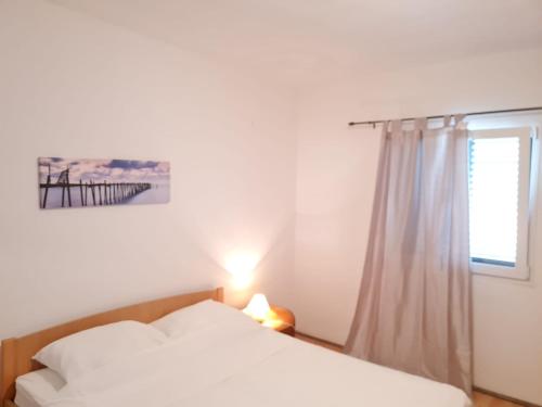Postel nebo postele na pokoji v ubytování Apartman Ivana