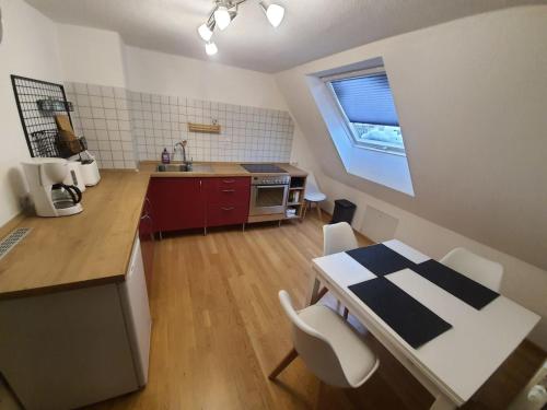 a kitchen with a table and chairs in a room at Ferienwohnung Brendle in Sankt Johann