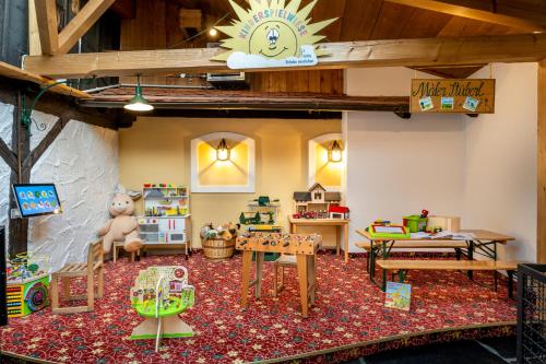 a room with many different types of toys in it at Hotel am Haslinger Hof in Bad Füssing