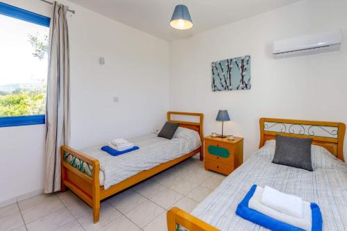 Postel nebo postele na pokoji v ubytování Villa Akti by Villa Plus