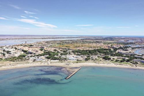 an aerial view of a beach and the ocean at Belambra Clubs Port Camargue - Les Salins in Le Grau-du-Roi