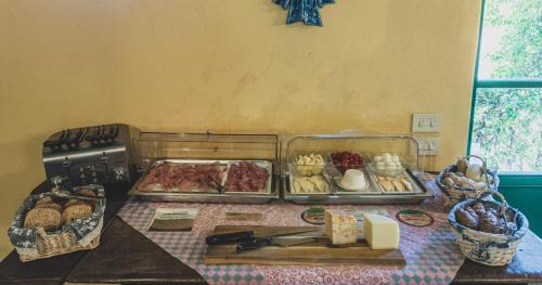 a table with some food on a table at Country Relais La Mortella in Porto Ercole