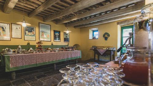 a room with a table with wine glasses in it at Country Relais La Mortella in Porto Ercole