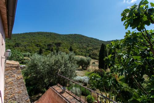 a view of a mountain from the balcony of a house at Country Relais La Mortella in Porto Ercole