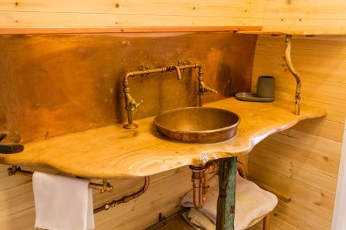 a wooden counter with a sink in a room at Beautiful 1 bed Glamping pod in Battle in Battle