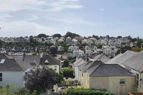 a group of houses and roofs in a town at Stylish, comfortable apartment with balcony in Plymouth