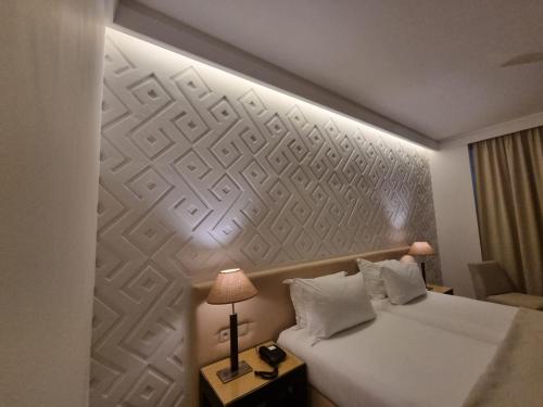a hotel room with a bed with a wall mural at Marina Smir Hotel & Spa in M'diq