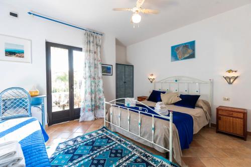 Säng eller sängar i ett rum på Villa Basilio Accommodation