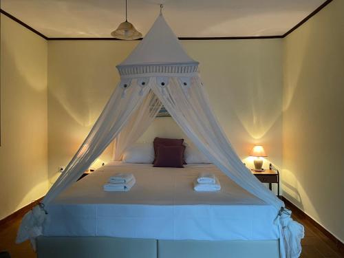 A bed or beds in a room at Cavo Plako Villas