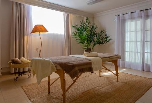 a bedroom with a bed and a potted plant at Marins Playa in Cala Millor
