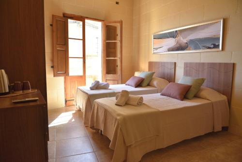 Giường trong phòng chung tại San Pawl B&b farmhouse- KORTOLL