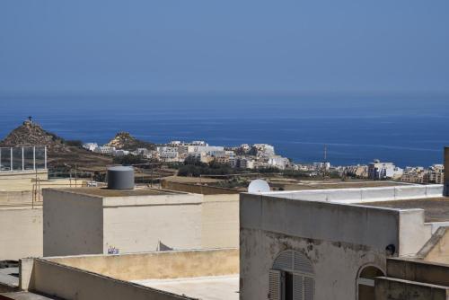 a view of the ocean from the roof of a building at San Pawl B&b farmhouse- KORTOLL in Tal-Barmil
