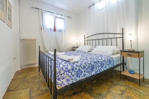 Postel nebo postele na pokoji v ubytování Anemoesa